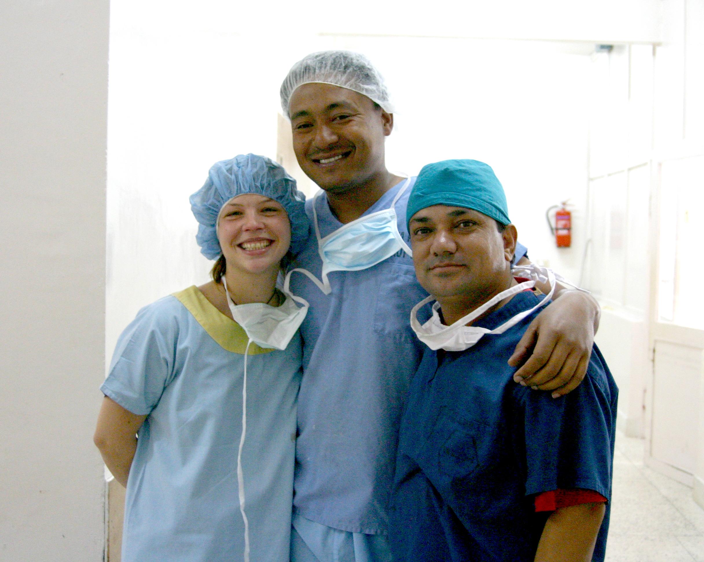 A Projects Abroad intern takes a photo with local doctors nearing the end of her medical internship in Nepal. Female Projects Abroad intern taking a photo with local doctors towards the end of her medical internship in Nepal.